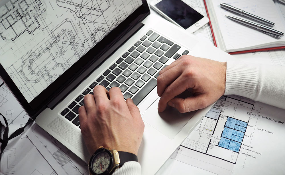 Person Working on Laptop Person Working on Laptop